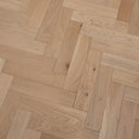 Unfinished light tan herringbone engineered wood flooring panel lines and speckled knots