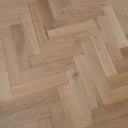 Light oak herringbone engineered wood flooring, bevelled plank joints in a staggered layout