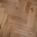 Engineered herringbone wood flooring, light brushed oak with linear grain and knots