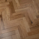 Engineered herringbone wood flooring, light oak planks with staggered herringbone pattern