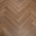 Honey oak herringbone vinyl flooring with woodgrain detail across planks