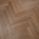 Honey oak herringbone SPC vinyl flooring view with natural woodgrain tones
