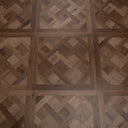 Caramel brown parquet floor panel with crosshatch wood pattern and rectangular tile layout