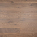 Light wood flooring planks in horizontal rows, showing natural swirl grain