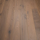Oiled light wood flooring planks with pronounced knots and linear grain