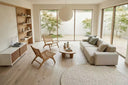 Engineered light grey wood flooring in a modern living room with furniture