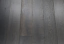 Jet black engineered wood flooring planks, straight top view