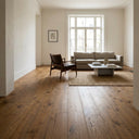 Engineered oak wood flooring planks in a bright living space, warm Berlin Oak tones