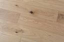 Brushed lacquered engineered wood flooring, light oak planks with knots and grain
