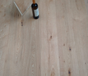Natural engineered click wood flooring plank, brushed matte finish, light oak tone