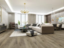Aged sandstone oak laminate flooring planks in an indoor room view