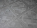 Silver grey parquet-pattern floor tile panel with diagonal herringbone lines