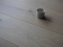 Engineered wood floor plank, light gray-beige with seam for classic invisible finish