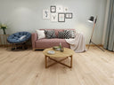 Natural oak WPC flooring planks with built-in underlay, installed in a living room