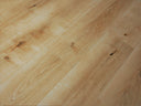 Natural oak WPC flooring planks close-up showing light wood grain pattern