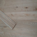 Natural engineered click flooring plank end detail, brushed matte light oak wood grain