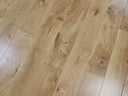 Lacquered solid wood flooring boards, light oak color with knots and grain