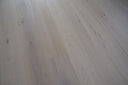 White oiled engineered wood flooring planks, straight seams and knots